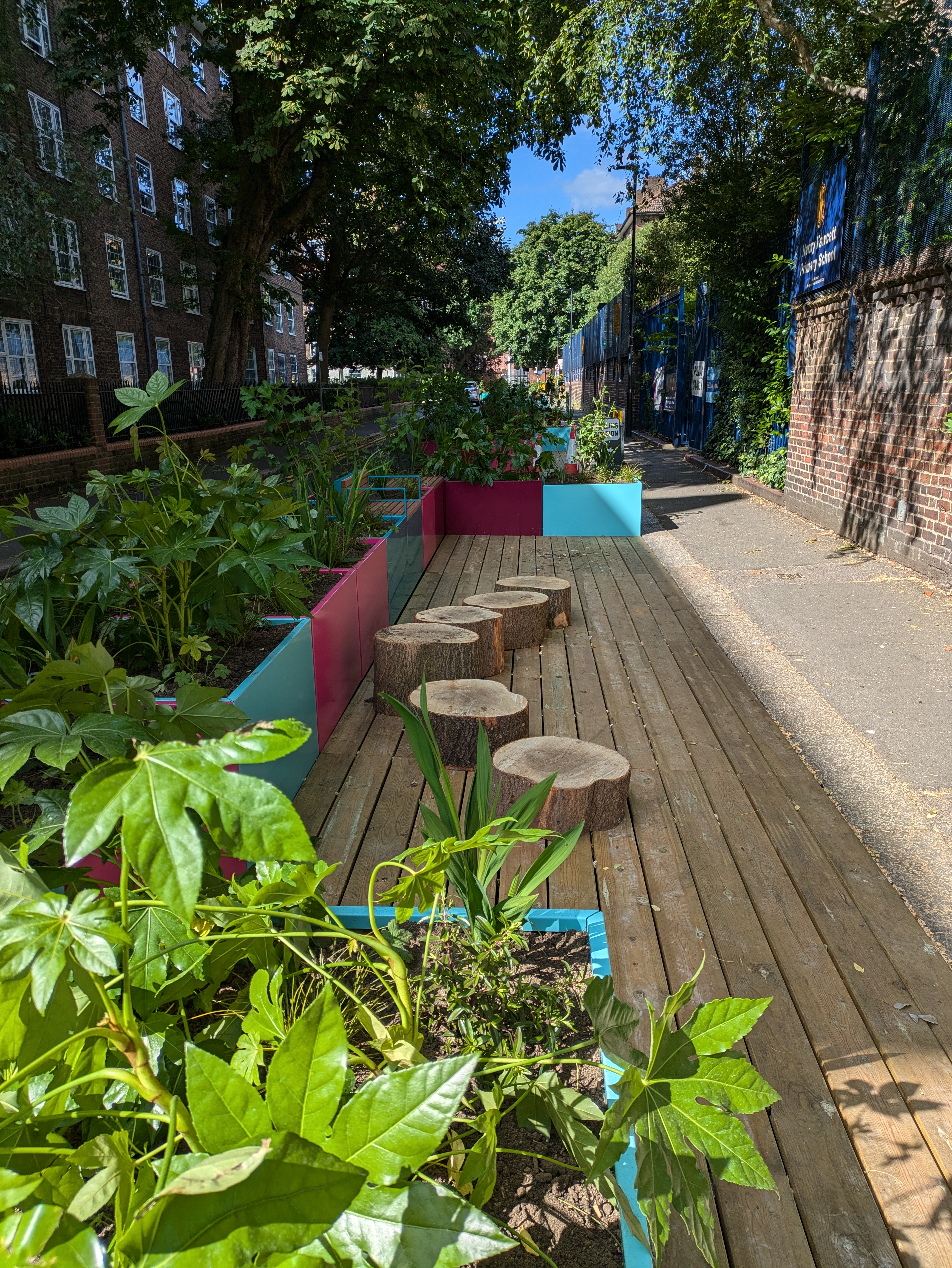 An image of the pavement extension with seating and stepping stumps outside Henry Fawcett